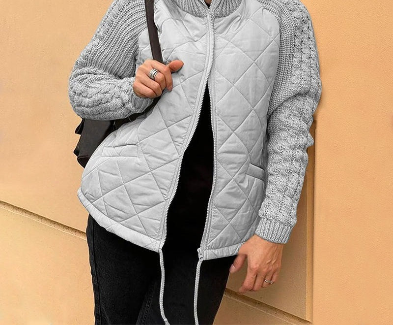 Women's quilted jacket with cable knit sleeves and a high collar - light grey