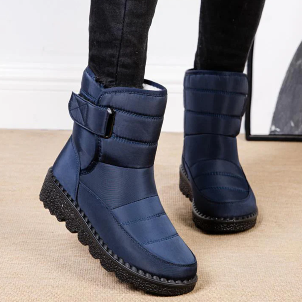 Women's quilted snow boots with a hook-and-loop strap and plush lining
