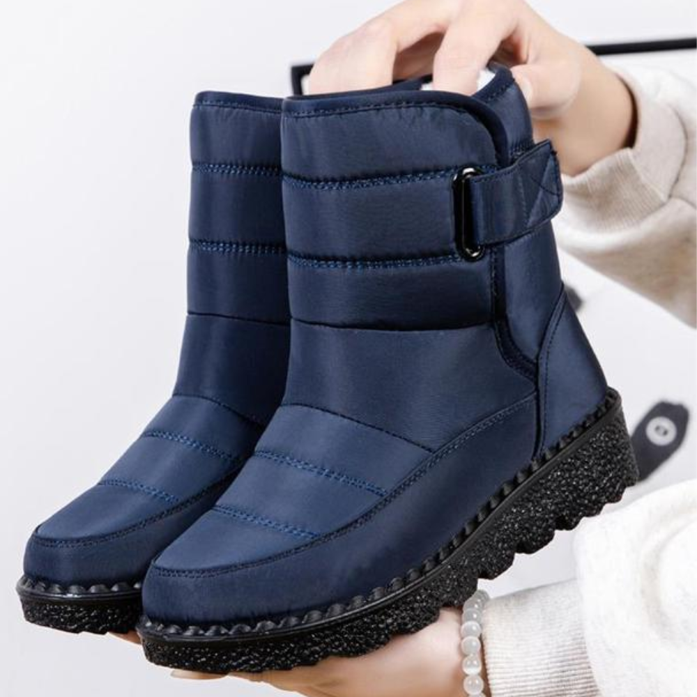 Women's quilted snow boots with a hook-and-loop strap and plush lining