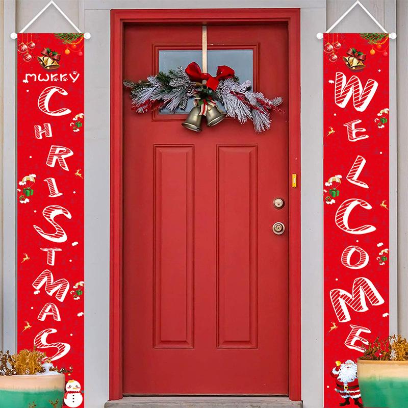 Set of two red Christmas porch banners, 180 x 30 cm, beside a front door