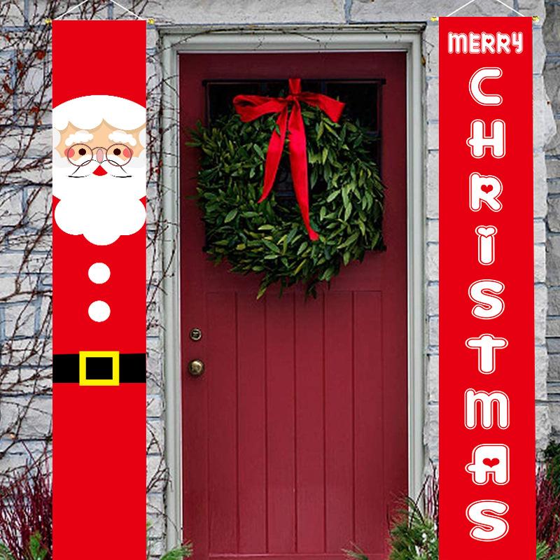 Set of two red Christmas porch banners, 180 x 30 cm, beside a front door