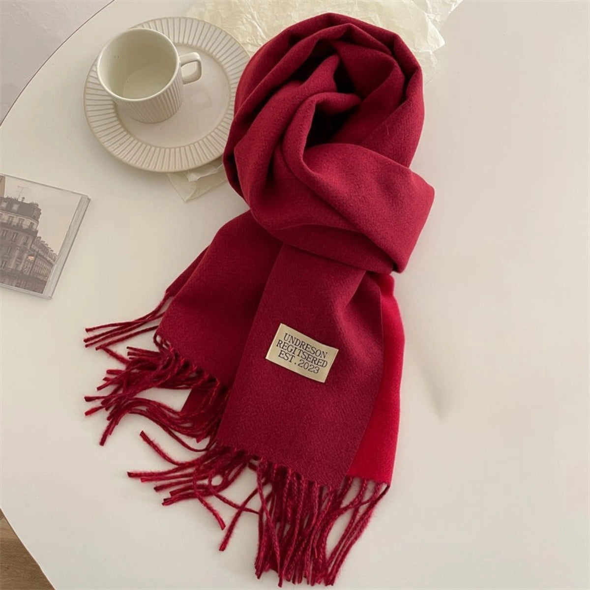 Women's reversible two-tone scarf with fringe and a small fabric label - red
