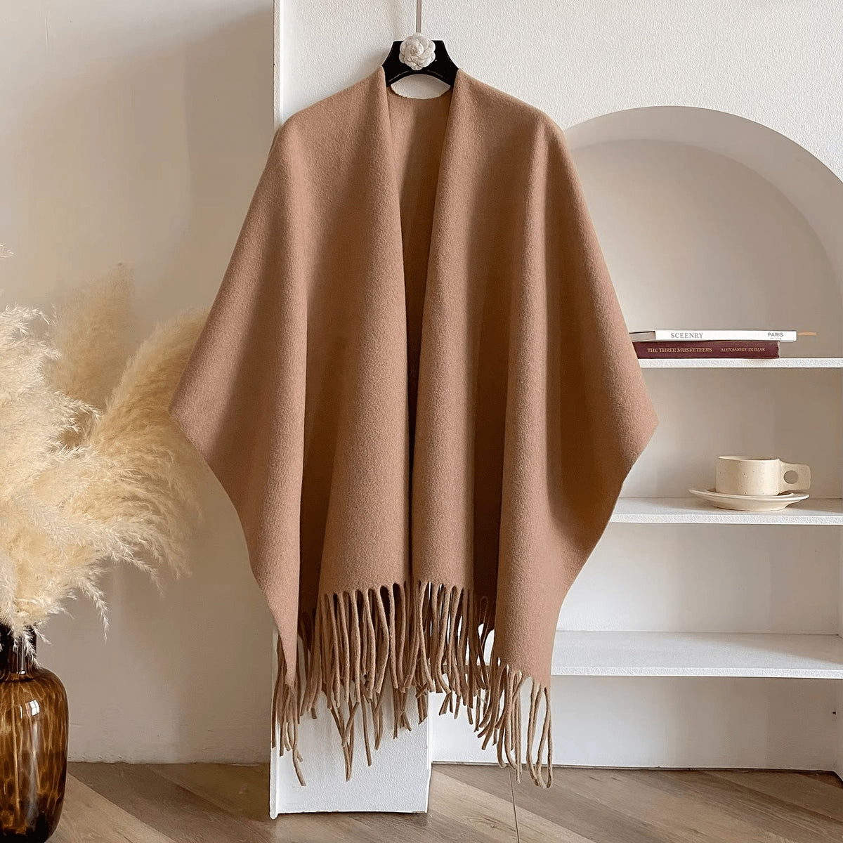 Reversible women's poncho in soft knit with fringe on a hanger - camel