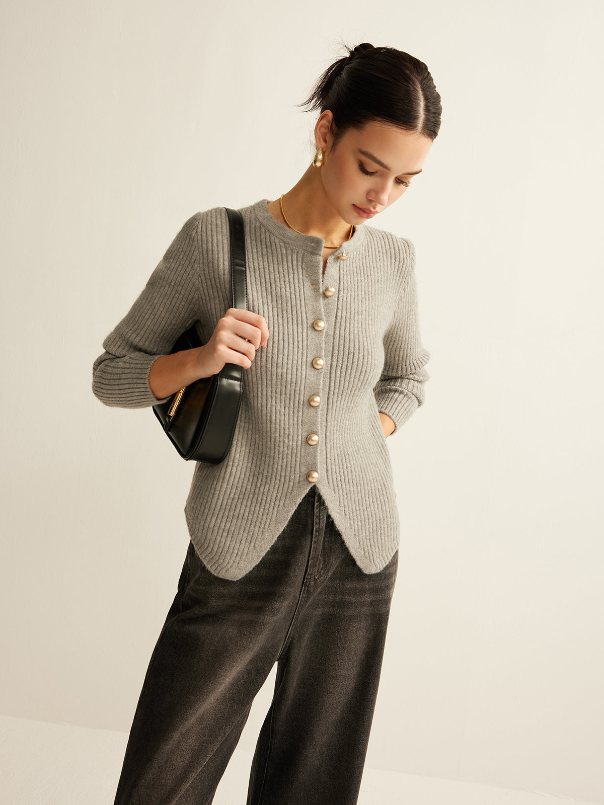 Women's ribbed crew neck cardigan with metal buttons and a scalloped hem