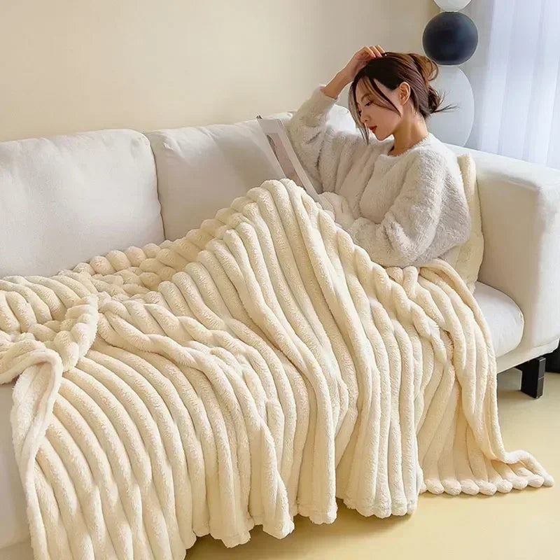 Ribbed faux fur blanket over a sofa