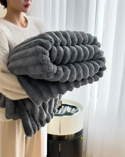 Ribbed faux fur blanket over a sofa - charcoal