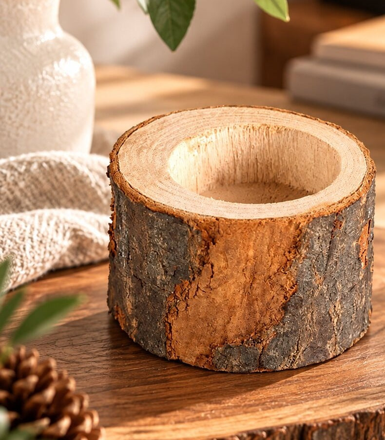 Two rustic wooden tea light holders cut from a log with the bark on - view 2