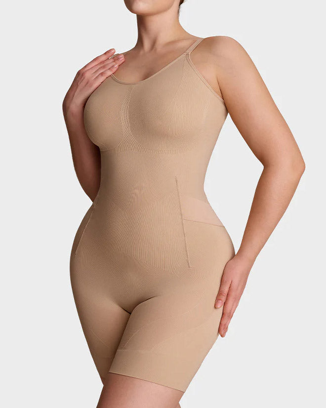 Seamless shapewear bodysuit with thin adjustable straps and legs to mid-thigh - nude