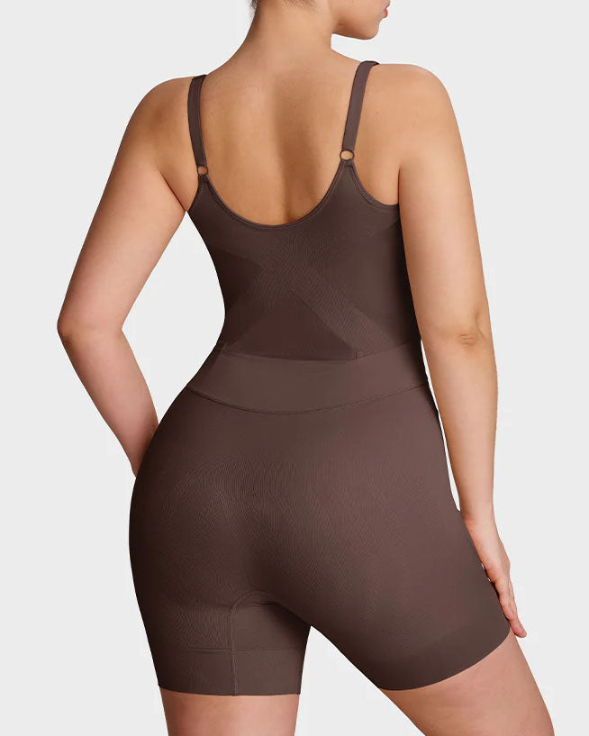 Seamless shapewear bodysuit with thin adjustable straps and legs to mid-thigh