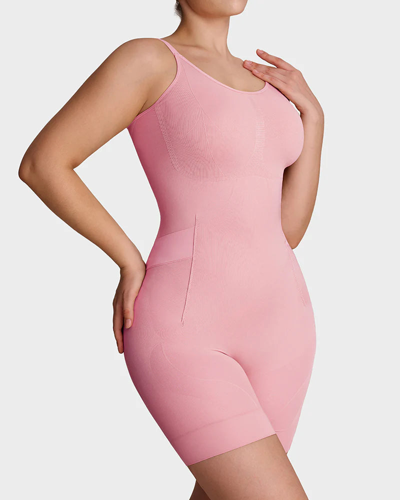 Seamless shapewear bodysuit with thin adjustable straps and legs to mid-thigh - pink