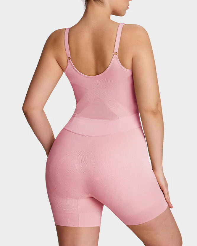 Seamless shapewear bodysuit with thin adjustable straps and legs to mid-thigh