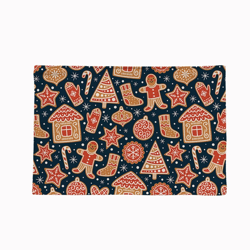 Set of four Christmas placemats with a festive print on a laid table - gingerbread on navy