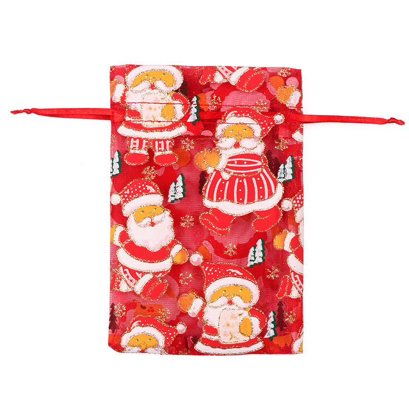 Sheer organza Christmas gift bags with red ribbon ties and festive print