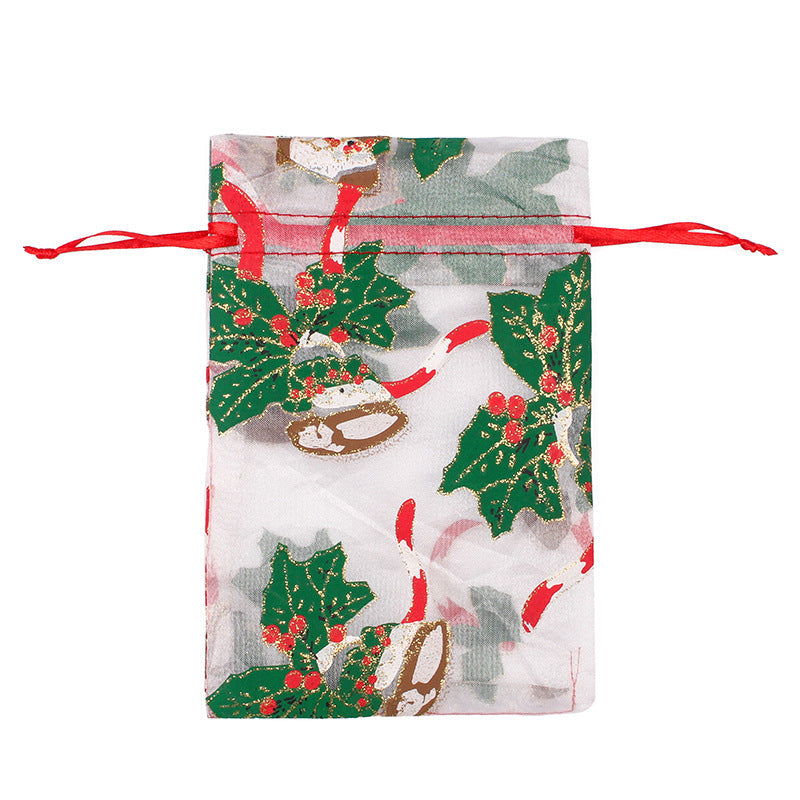 Sheer organza Christmas gift bags with red ribbon ties and festive print