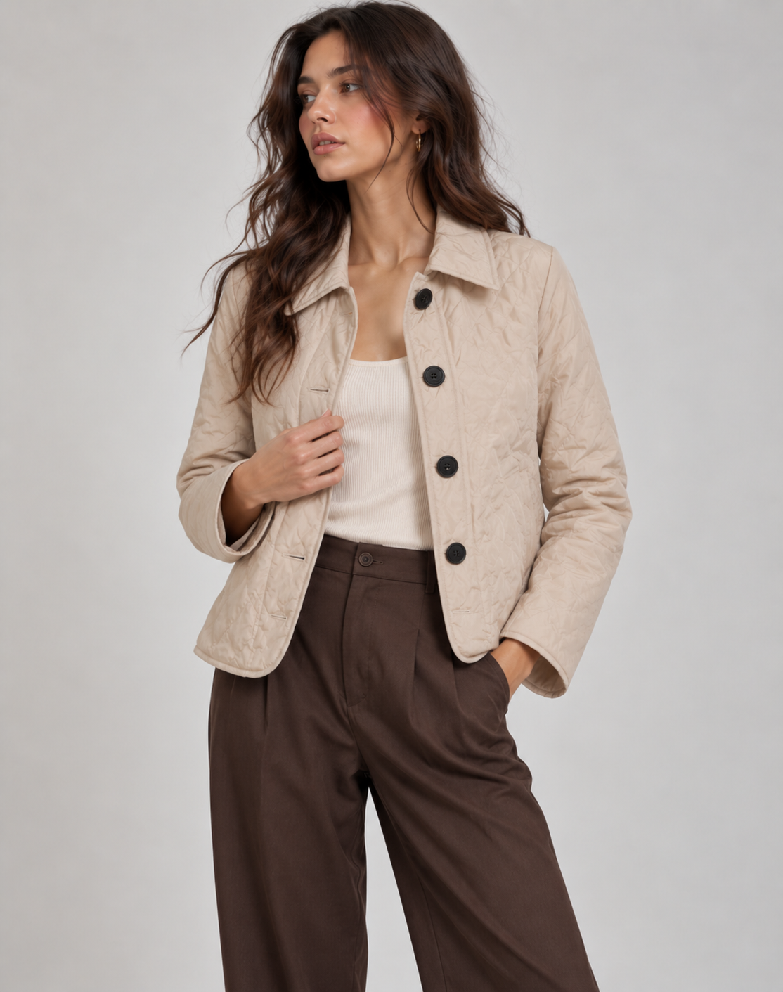 Short quilted jacket for women with shirt collar, four buttons and wavy quilting