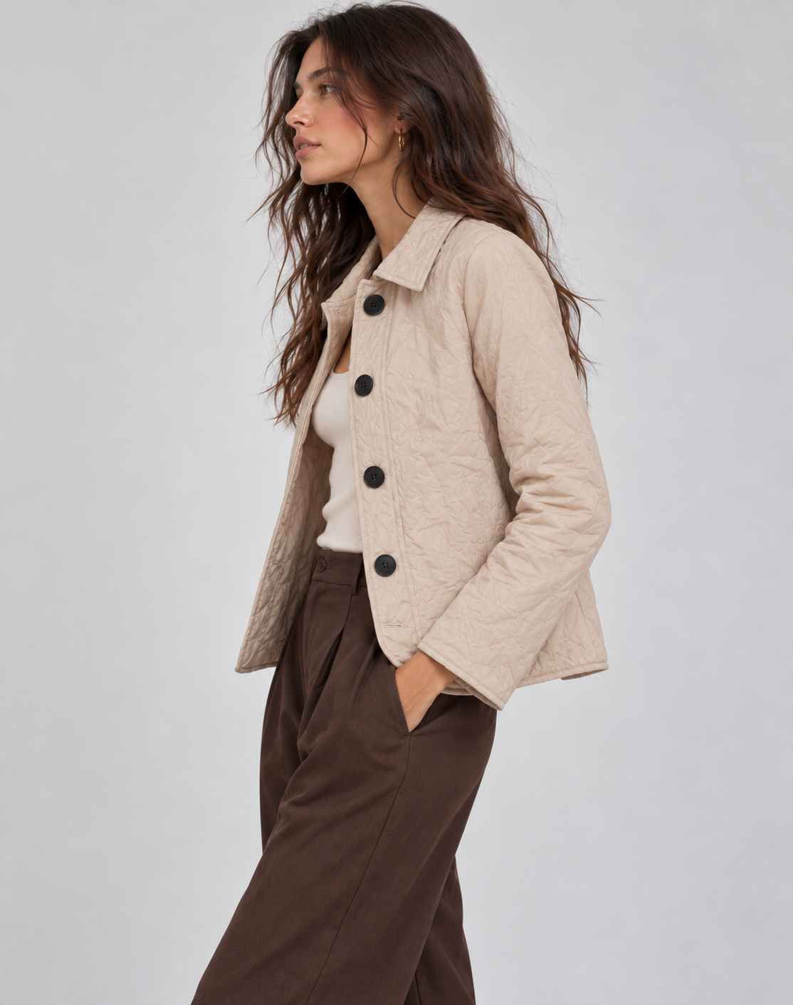 Short quilted jacket for women with shirt collar, four buttons and wavy quilting