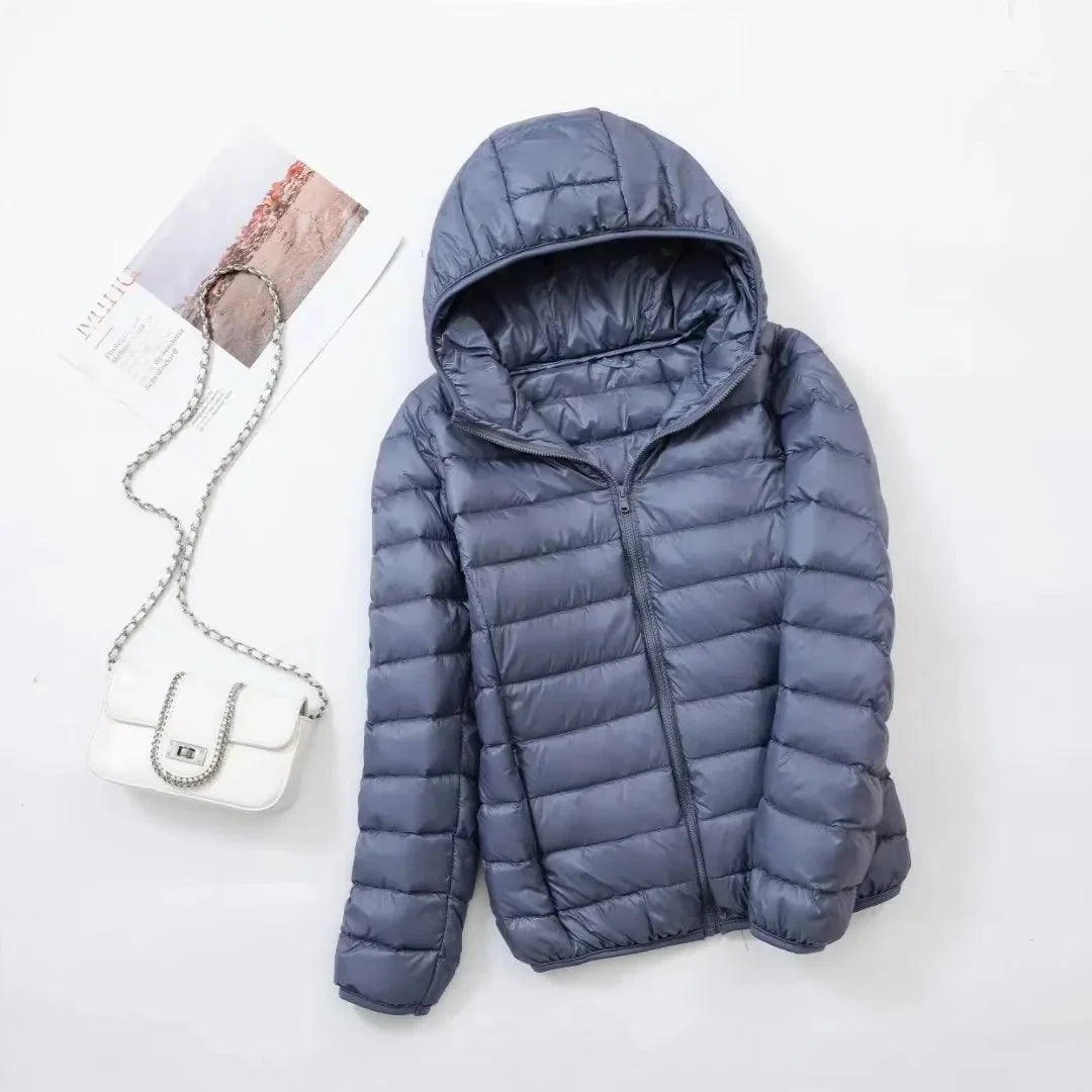 Women's slim lightweight puffer jacket with narrow quilting and a hood - grey blue
