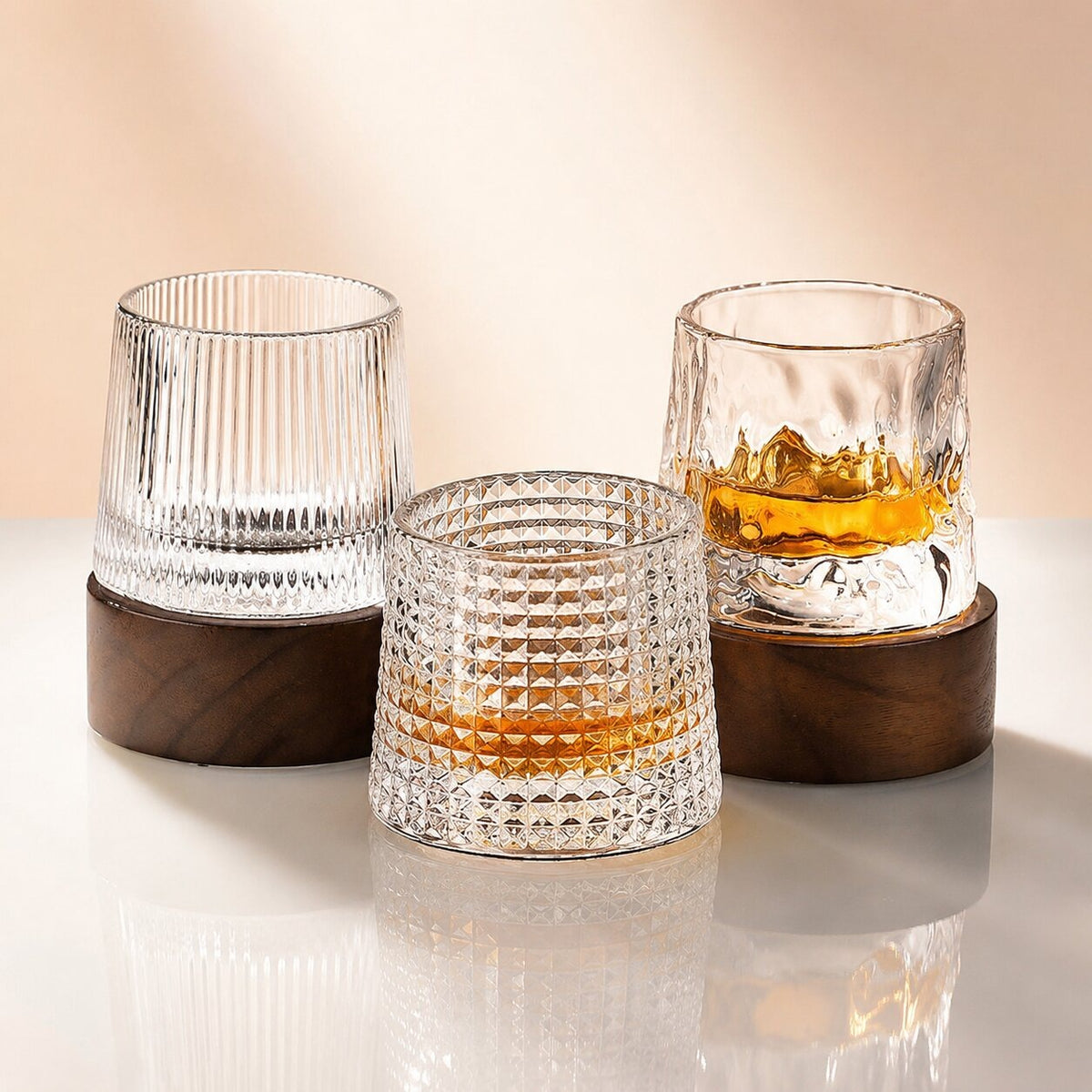 Spinning whisky glass with a rounded base and a wooden coaster