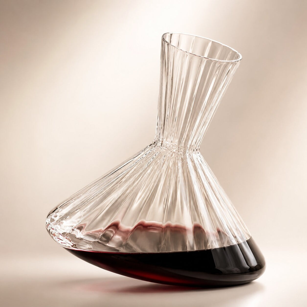 Spinning ribbed glass wine decanter on a round coaster - view 2