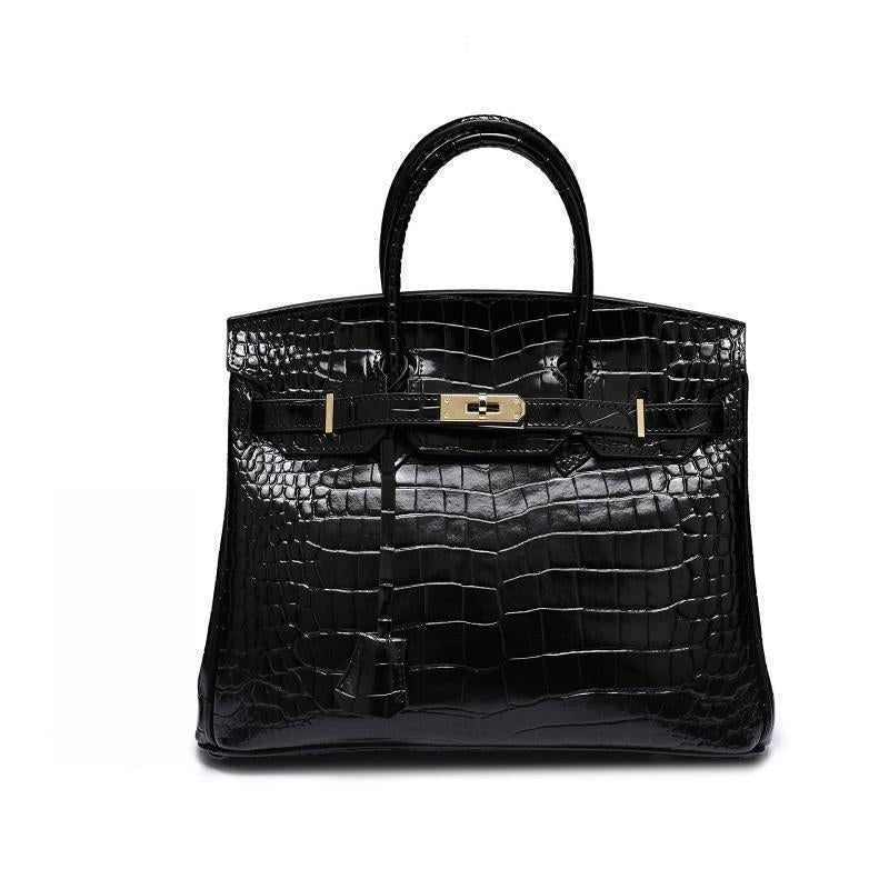 Structured top handle bag with two rolled handles, a flap with turn lock and a padlock - black croc