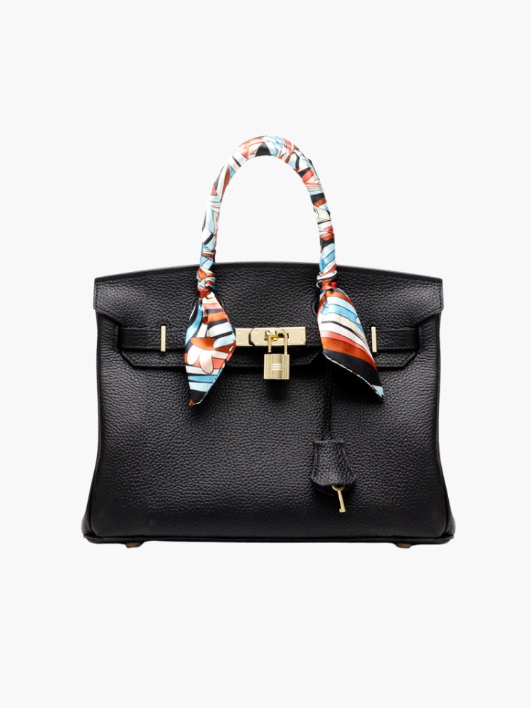 Structured top handle bag with two rolled handles, a flap with turn lock and a padlock - black with scarf