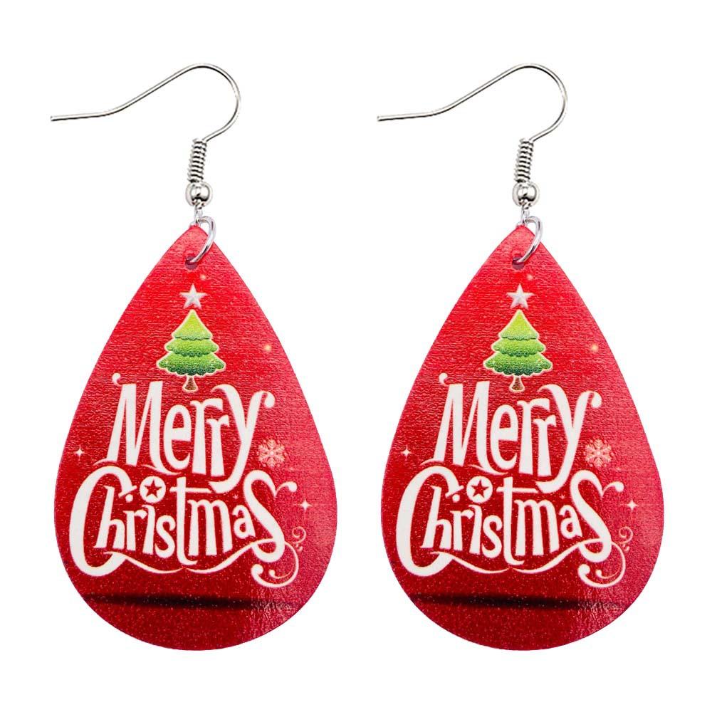 Faux leather teardrop Christmas earrings with a festive print on hooks - merry christmas on red