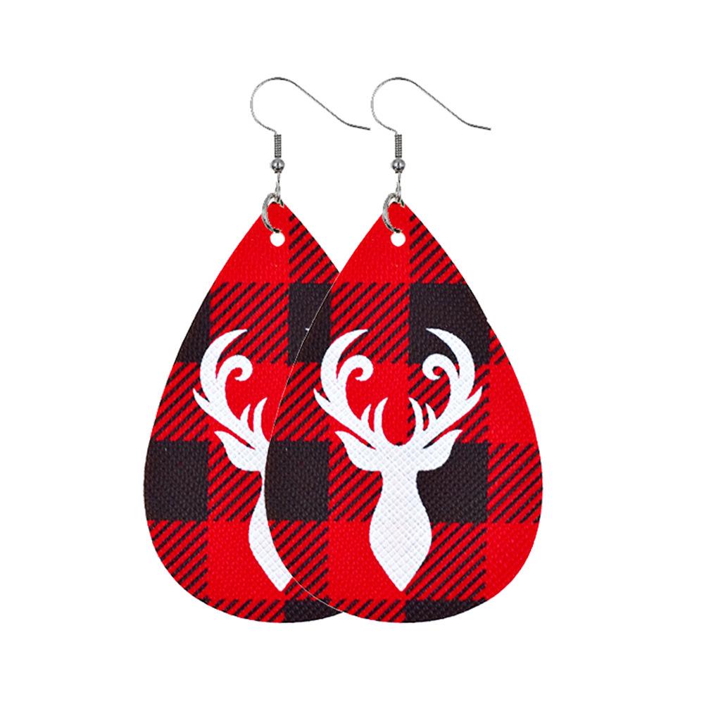 Faux leather teardrop Christmas earrings with a festive print on hooks - white antlers on red check