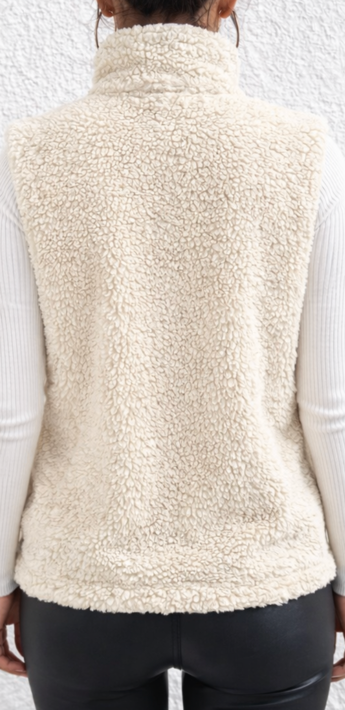 Women's teddy gilet with a high stand collar, full-length zip and side pockets