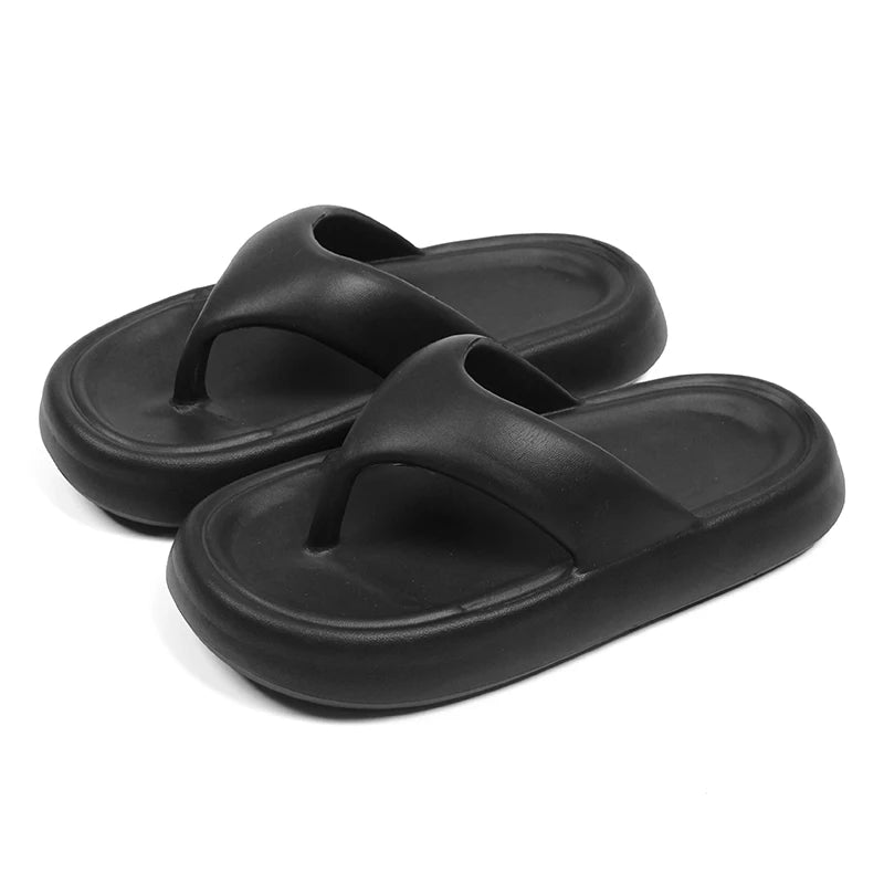 Flip flops with a thick, soft EVA sole and a wide flat toe strap - black