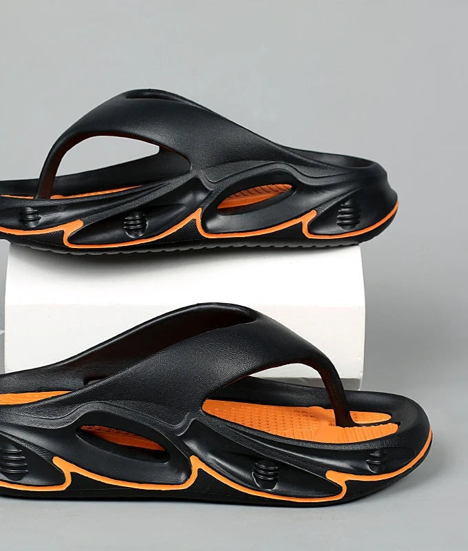 EVA flip flops with a thick sole and a two-tone nubbed footbed - black and orange