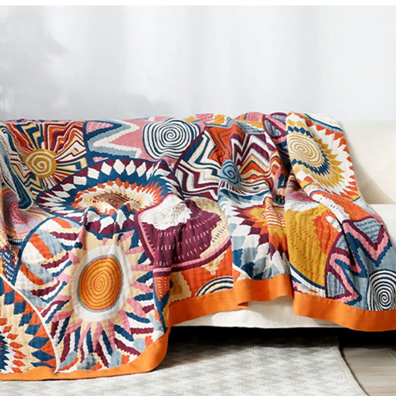 Woven throw with a colourful sun pattern and an orange border - 200 x 229 cm