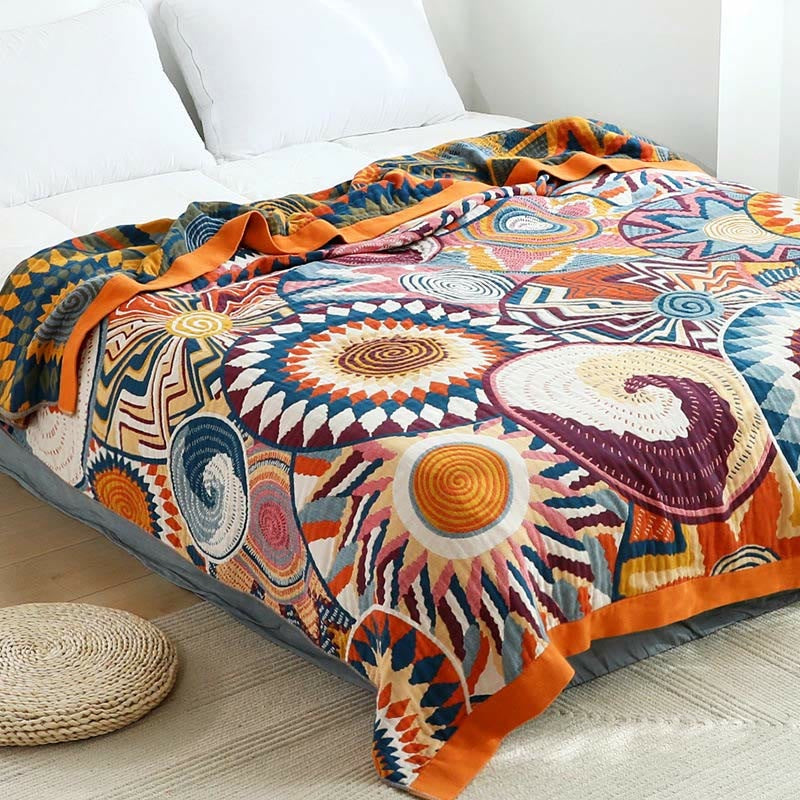Woven throw with a colourful sun pattern and an orange border - view 2