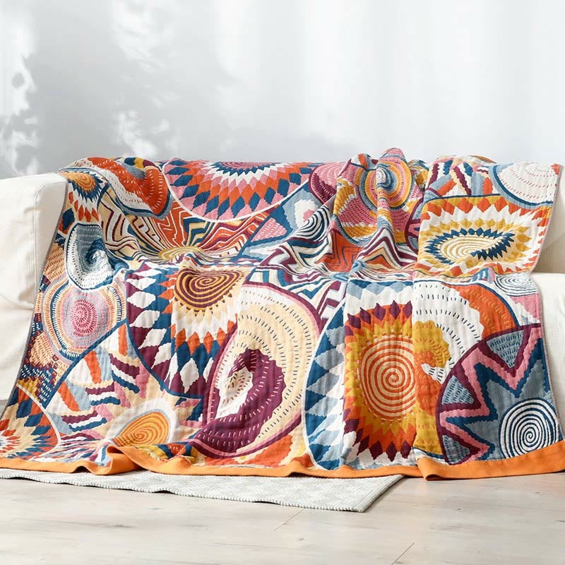 Woven throw with a colourful sun pattern and an orange border - 229 x 249 cm