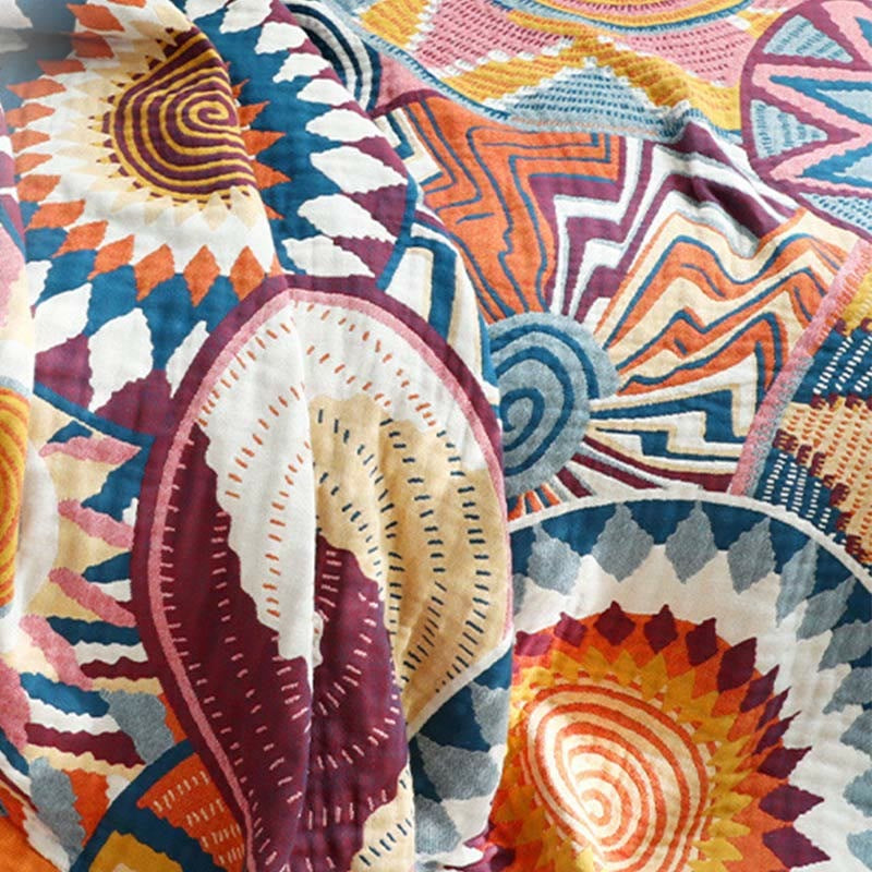 Woven throw with a colourful sun pattern and an orange border - view 7