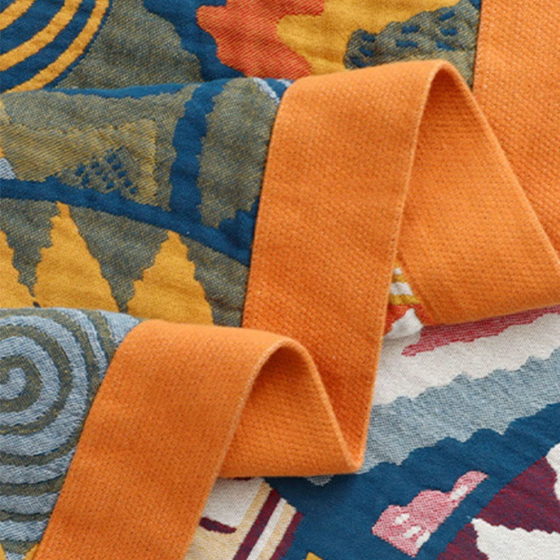 Woven throw with a colourful sun pattern and an orange border - view 9