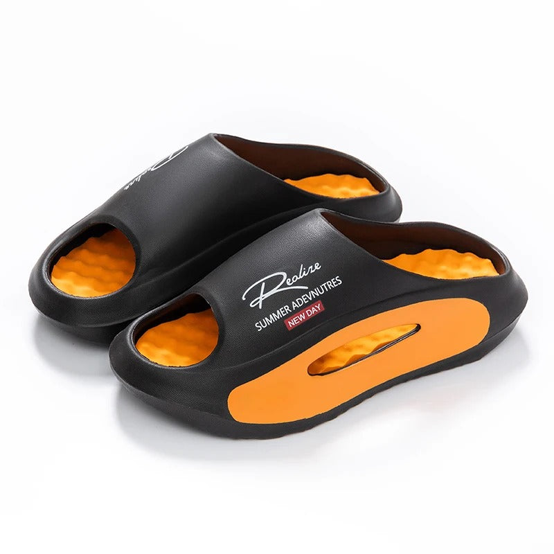 EVA sliders with a wavy footbed in a contrasting colour and thick sole - black / orange