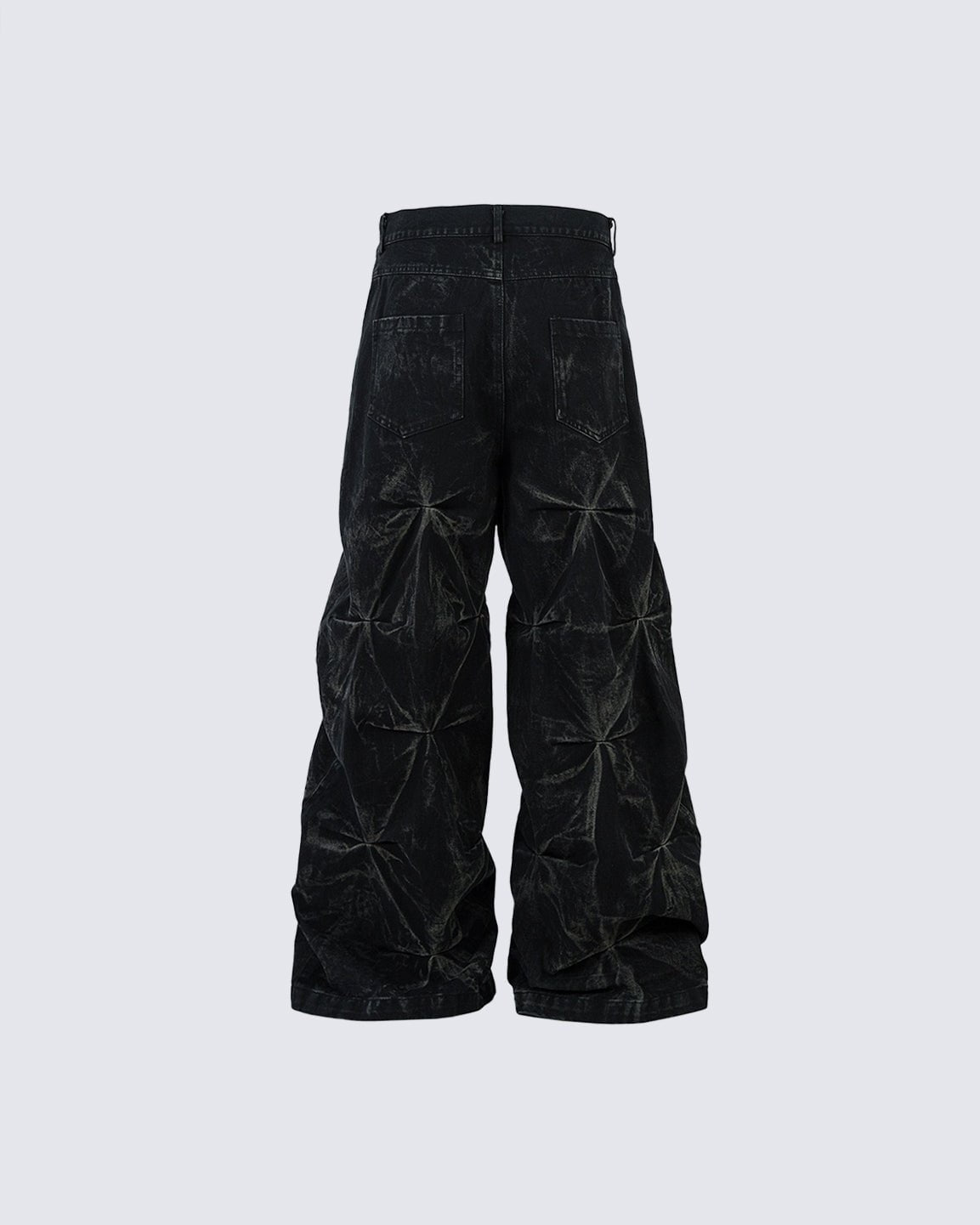 Wide baggy jeans with a pleated crinkle texture and waxed finish