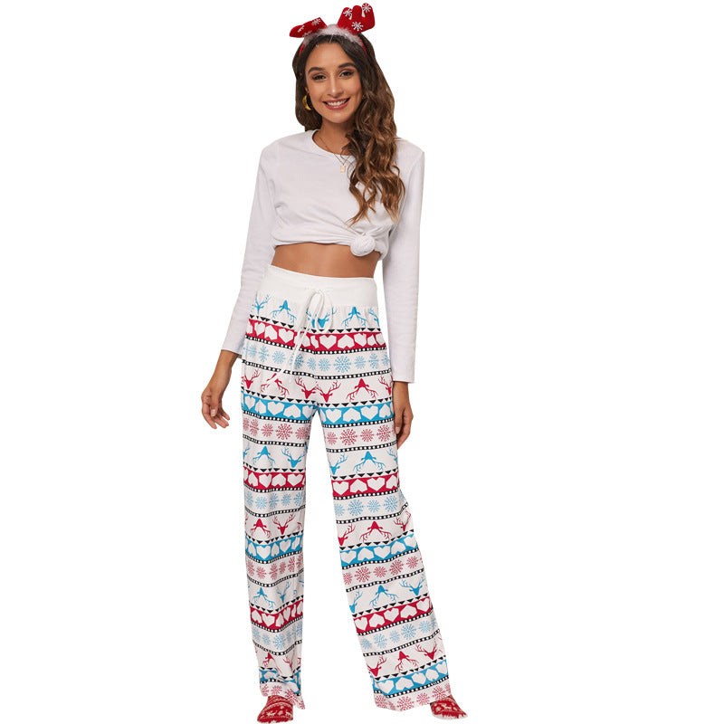 Women's wide-leg Christmas trousers with a high drawstring waist and festive print