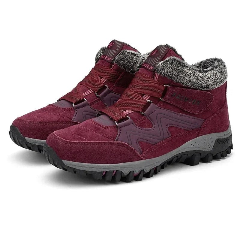 Unisex winter trainers with elastic straps and a faux fur collar in wine red