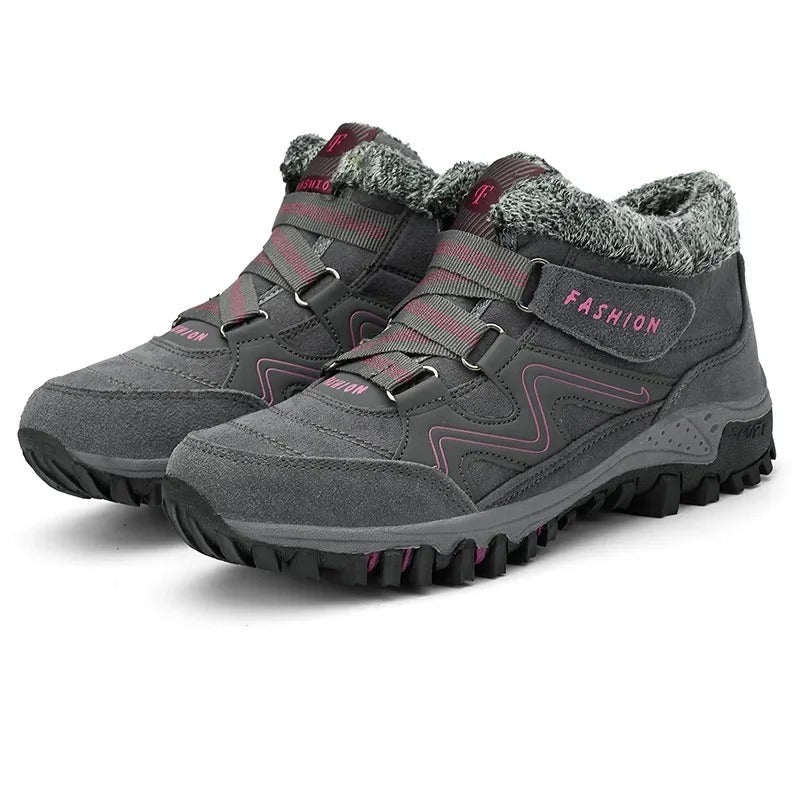 Unisex winter trainers with elastic straps and a faux fur collar in grey