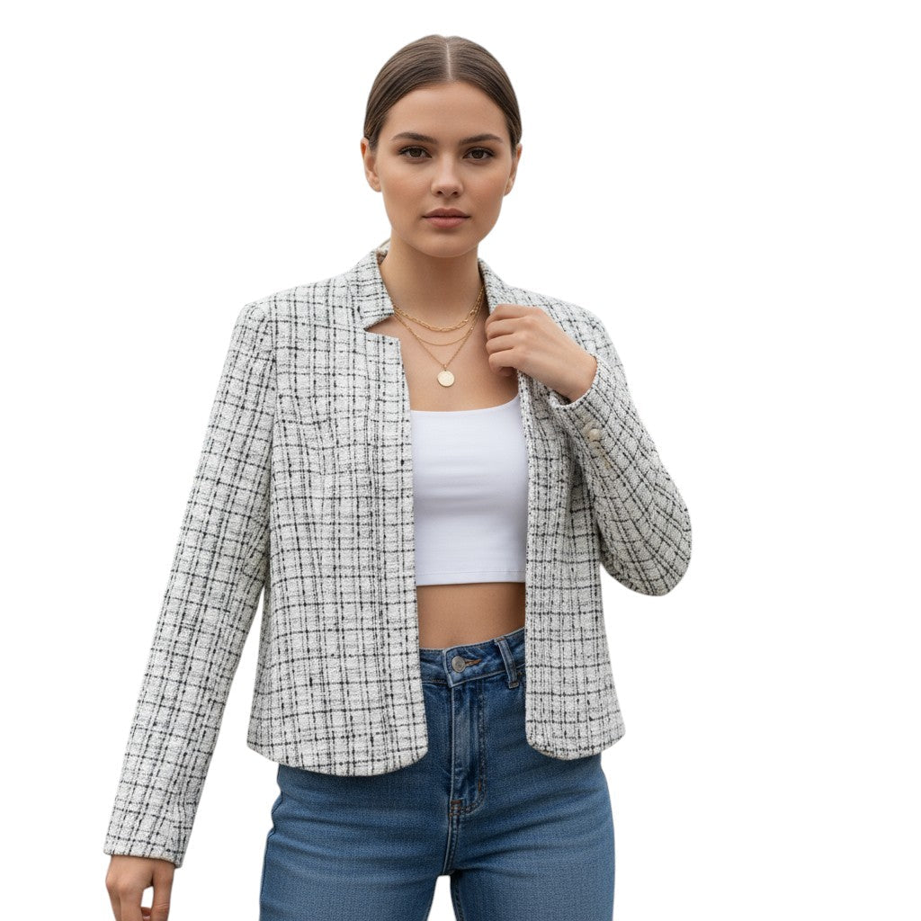 Collarless tweed jacket with a frayed trim, worn open in oat and grey