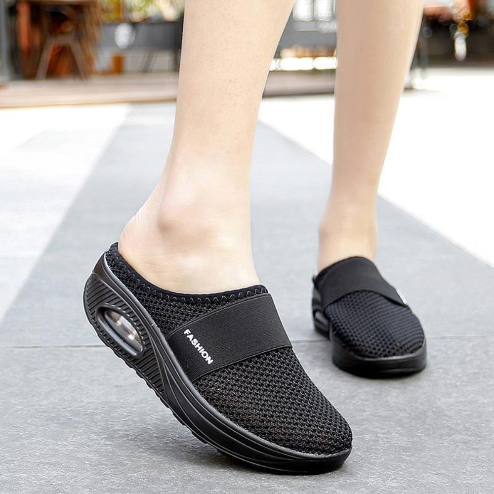 Women's backless mesh trainers with an air cushion sole