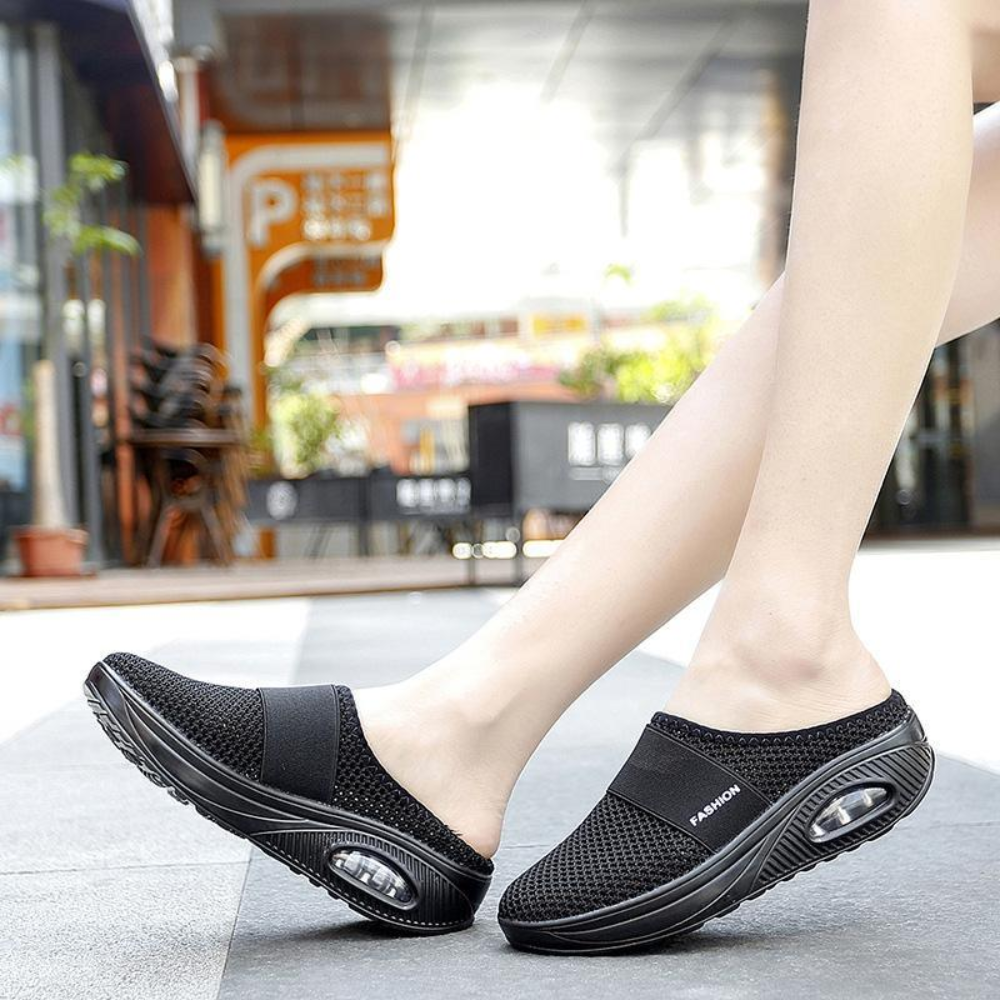 Women's backless mesh trainers with an air cushion sole