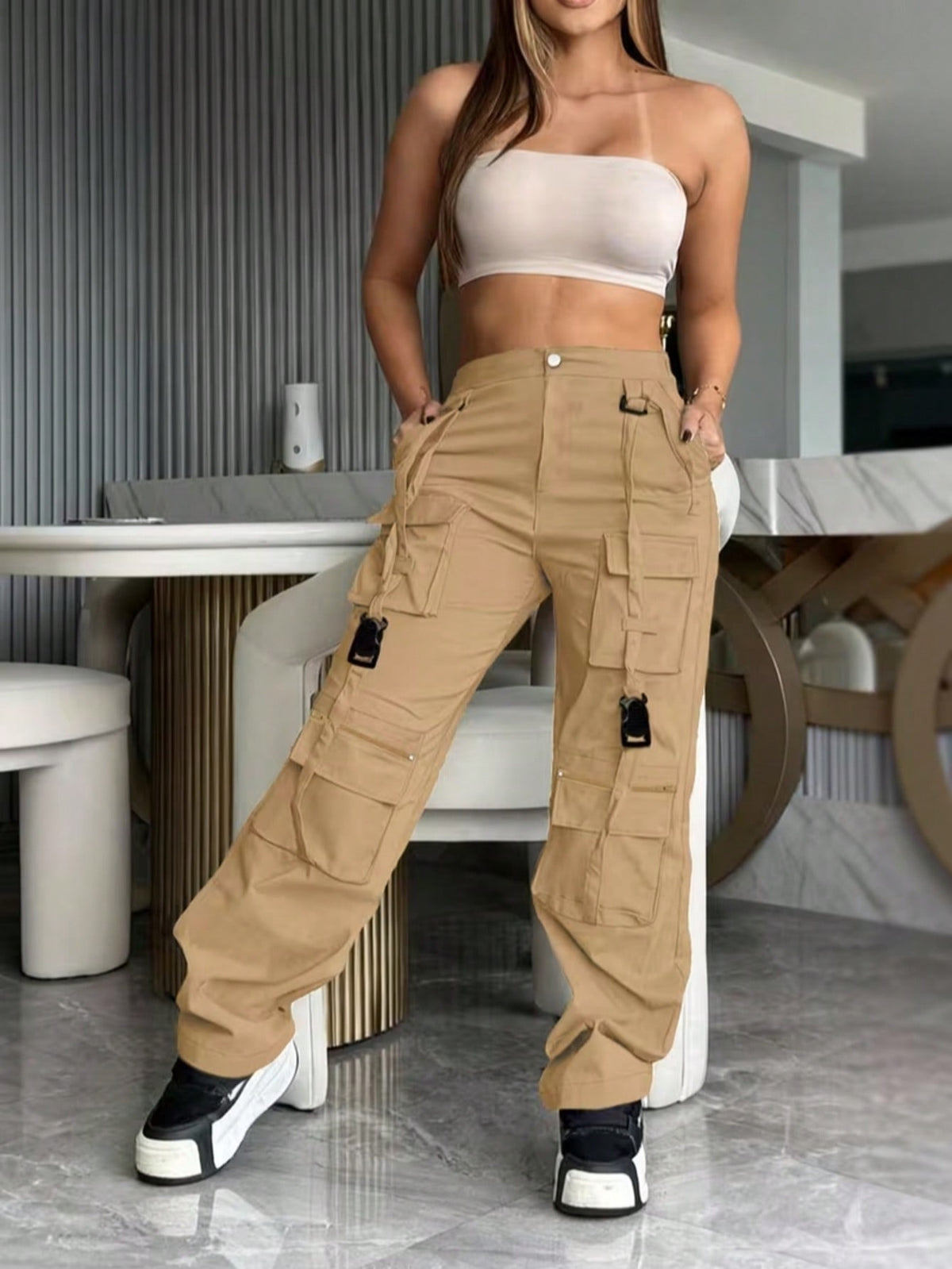 Cargo trousers for women with many pockets, loops and straps on the legs and a straight wide leg - view 10