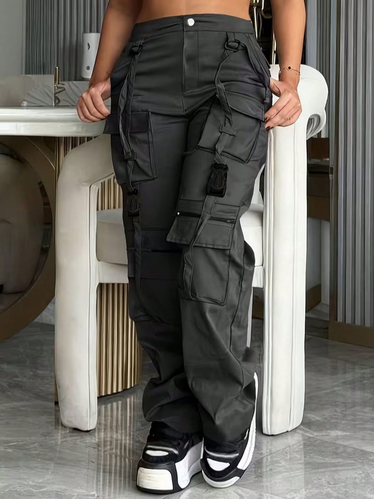 Cargo trousers for women with many pockets, loops and straps on the legs and a straight wide leg - view 7