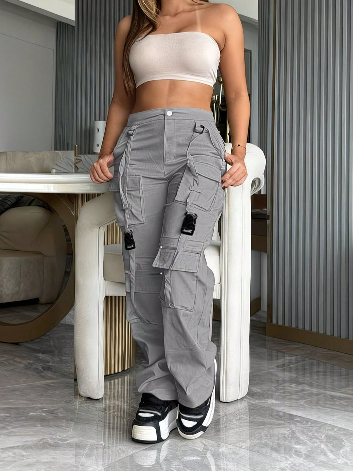 Cargo trousers for women with many pockets, loops and straps on the legs and a straight wide leg - view 8