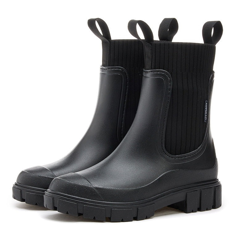 Women's Chelsea rain boots with a ribbed knit collar and lug sole - black