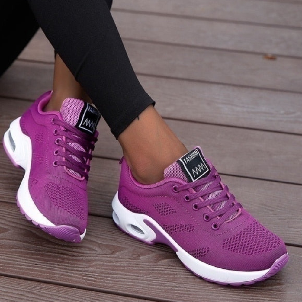 Women's ergonomic knit trainers with an air cushion sole