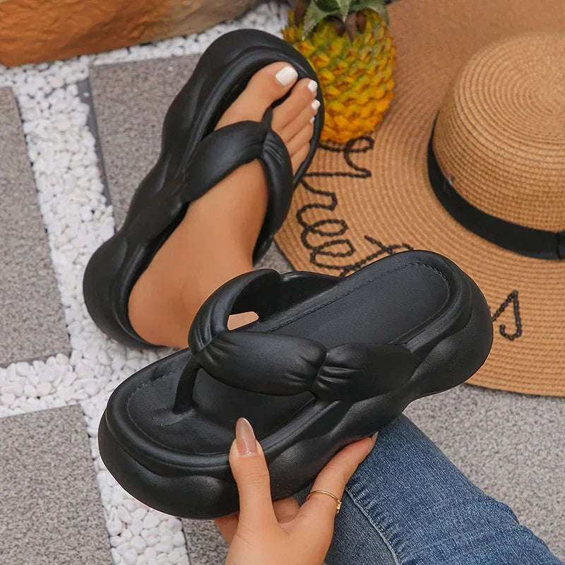 Flip flops in EVA with a puffy ruched strap and a high wavy platform sole - view 2