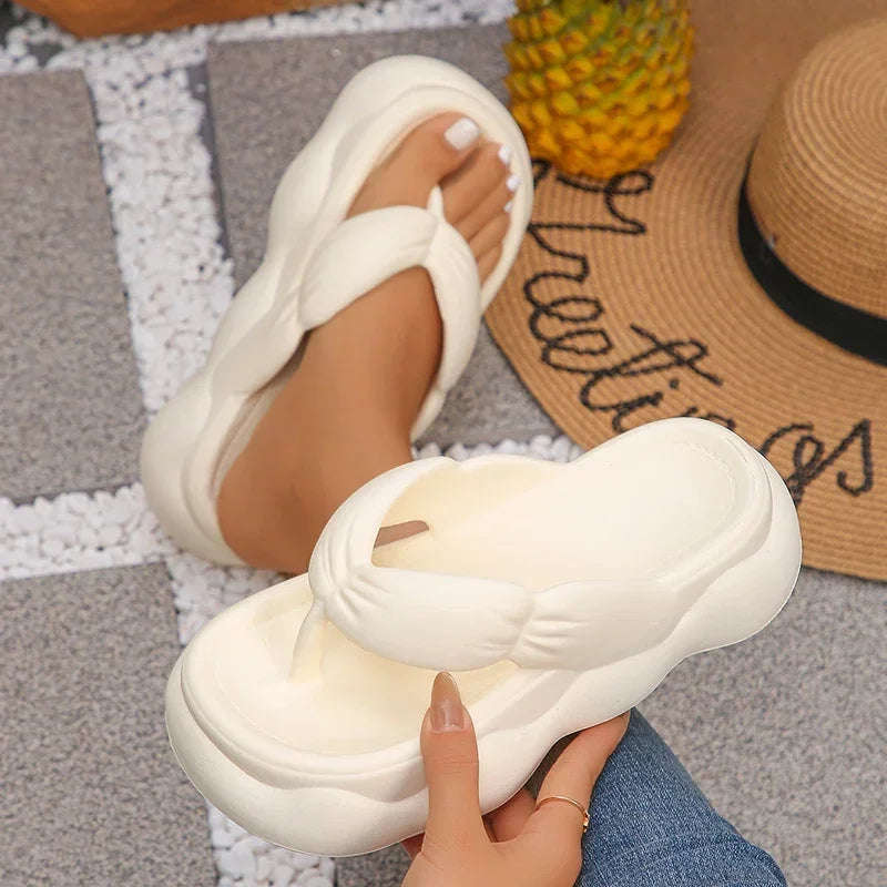 Flip flops in EVA with a puffy ruched strap and a high wavy platform sole - view 3